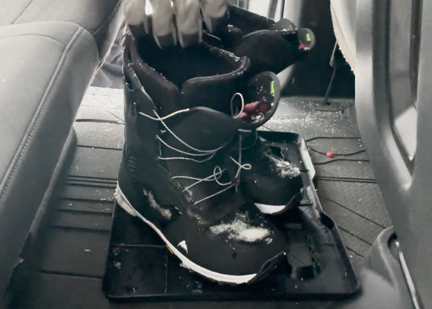 Edge Product with Wet Boots Sitting on It in back of car
