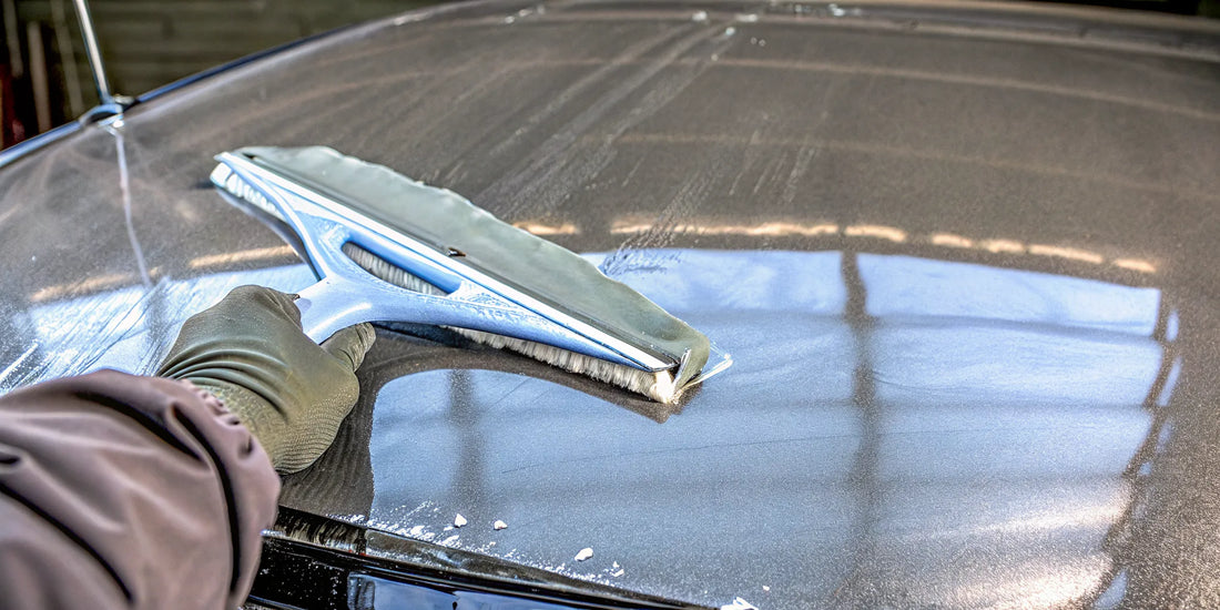 Car paint friendly ice scraper clearing ice from a vehicle without scratches.
