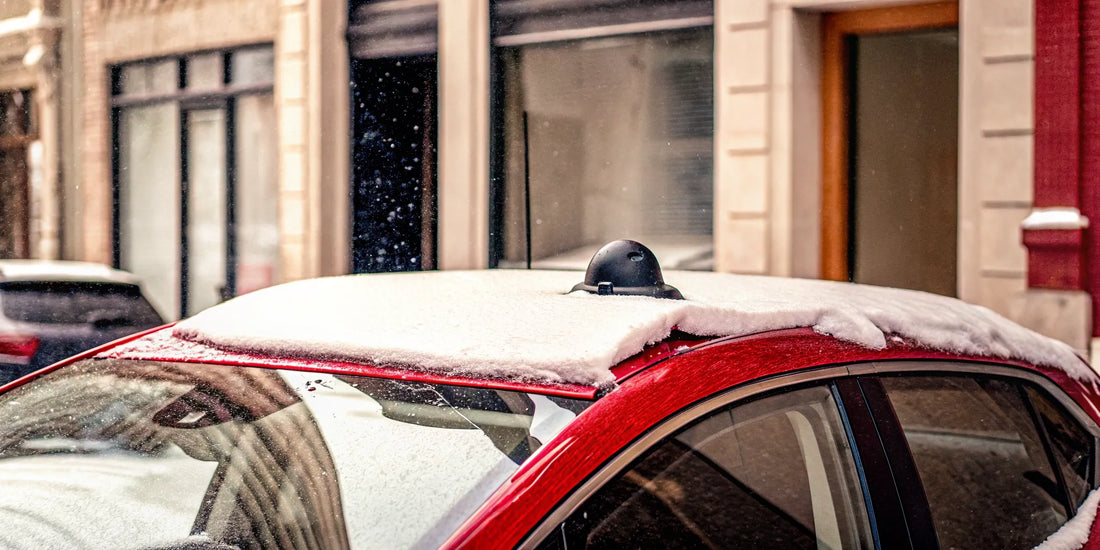 A car covered in thick snow, a job for the best snow scraper.