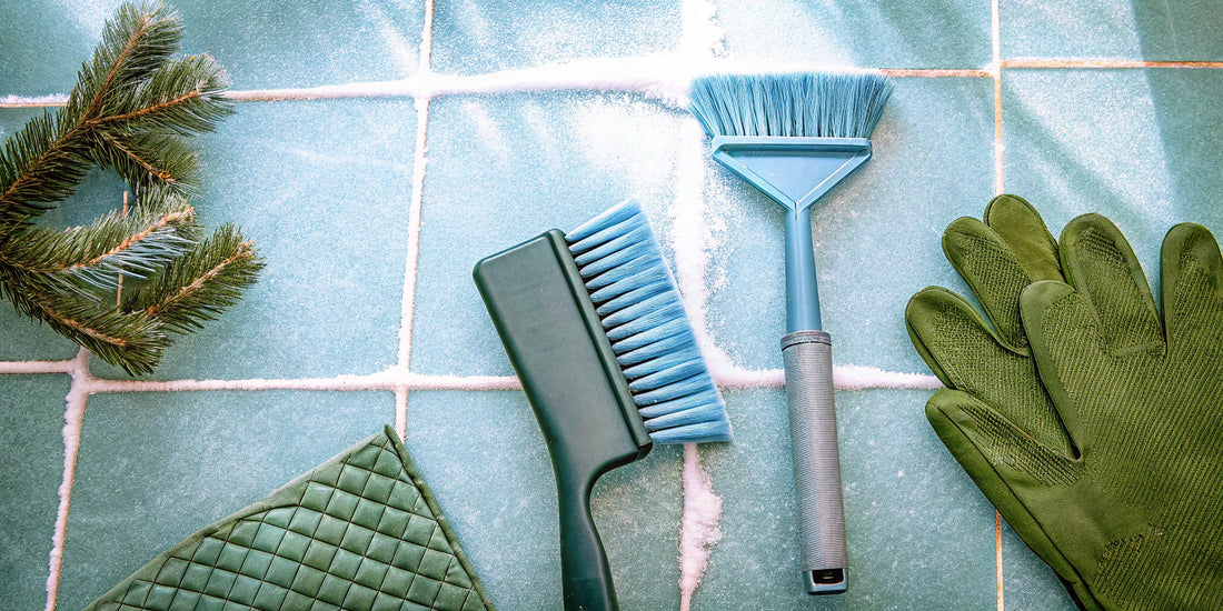 Promotional winter car safety items like a branded ice scraper, snow brush, and gloves.
