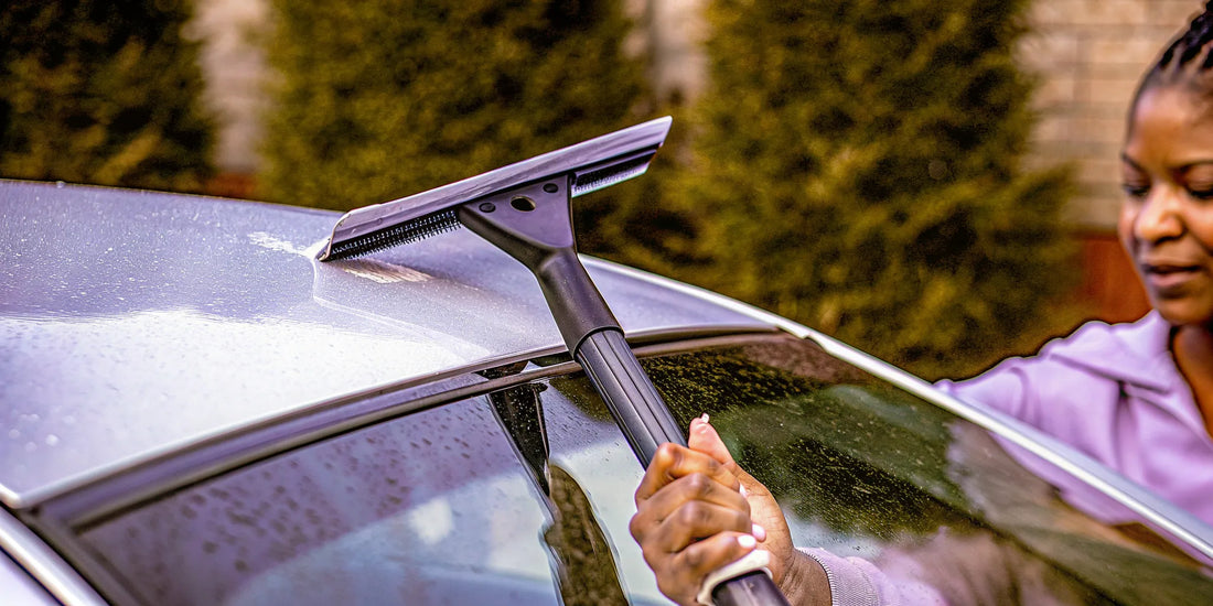 Best windshield ice scraper with a strong blade and grip clearing ice from a car.