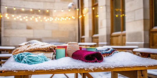 A display of the best winter fundraiser products for schools, including holiday mugs and cozy blankets.