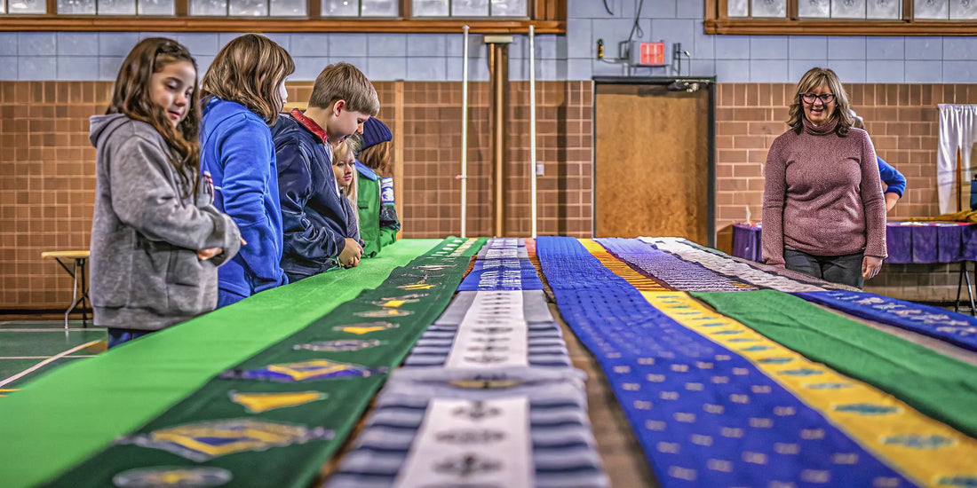 Custom winter car scrapers for school fundraising displayed on a table