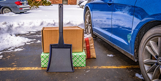 Corporate holiday gift featuring a practical winter scraper for drivers