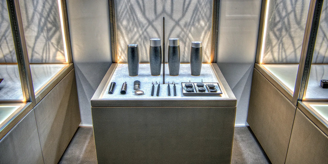 Custom company merch for tradeshows, including branded water bottles and tech gadgets.