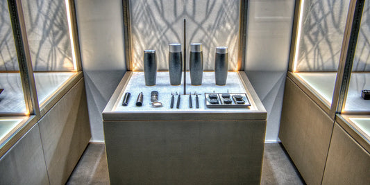 Custom company merch for tradeshows, including branded water bottles and tech gadgets.