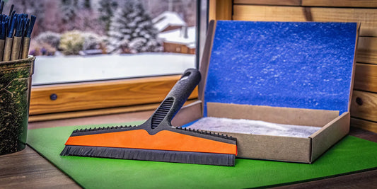 Custom branded Edge ice scraper presented as a premium corporate gift in an office setting