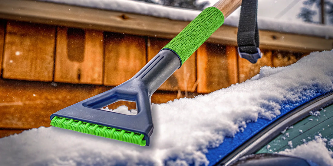 An oversized ice scraper clearing thick ice from a car windshield.