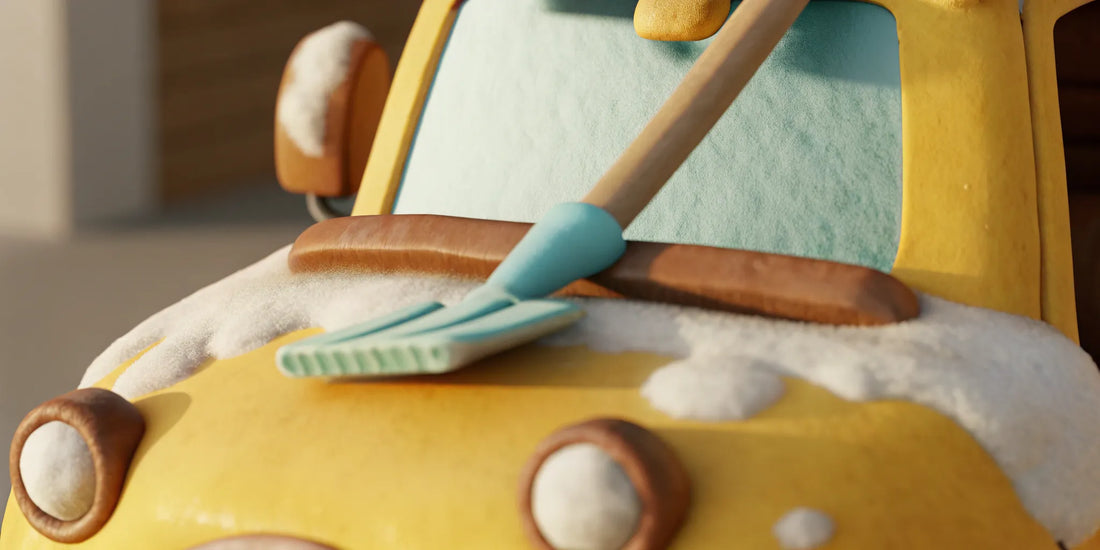 Scraping ice off a car windshield with a plastic scraper to prevent damage.