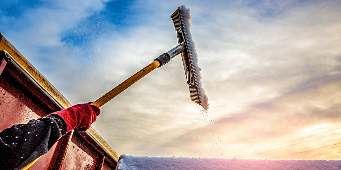 Heavy duty ice scraper for trucks breaking through thick ice on a large windshield.