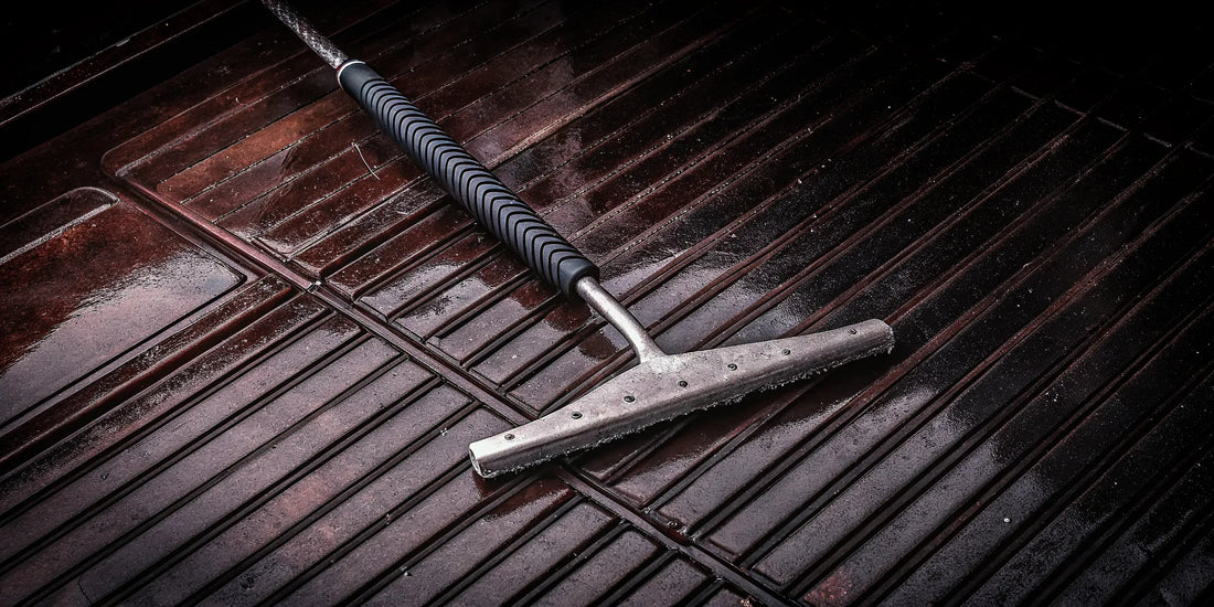 A durable steel ice scraper with a strong blade and ergonomic grip.