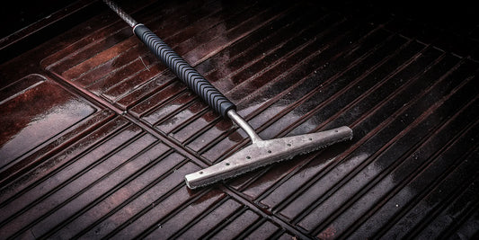 A durable steel ice scraper with a strong blade and ergonomic grip.