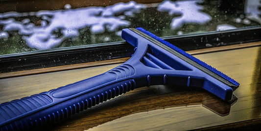 A blue ice scraper, a cost-effective option for buying ice scrapers in bulk.