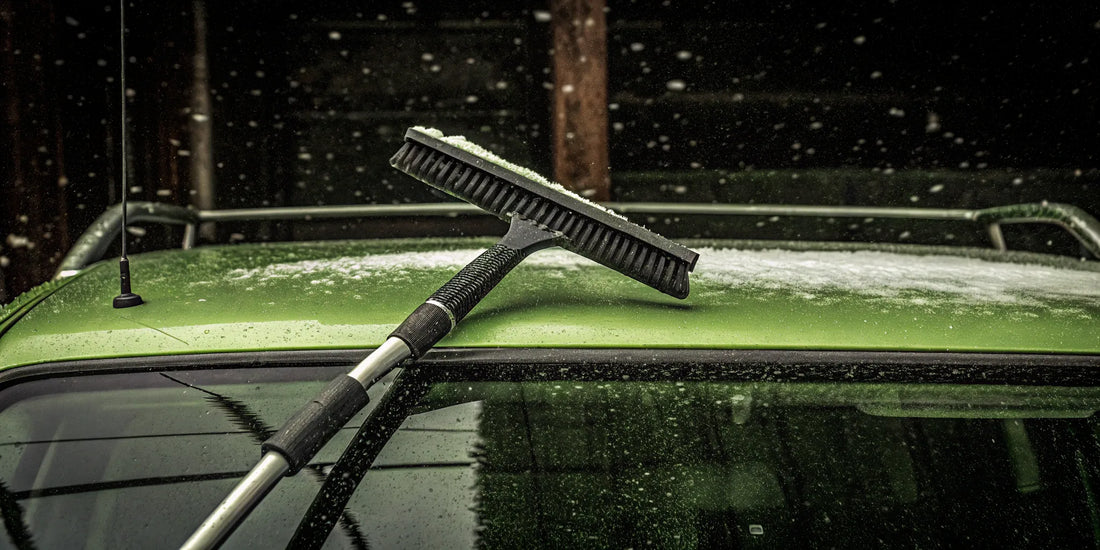 Extra long snow remover clearing snow from a fleet vehicle roof.