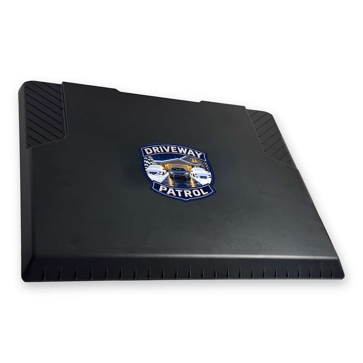 The EDGE snow and ice scraper with the Driveway Patrol Badge print, 6 x 6 in, angled view
