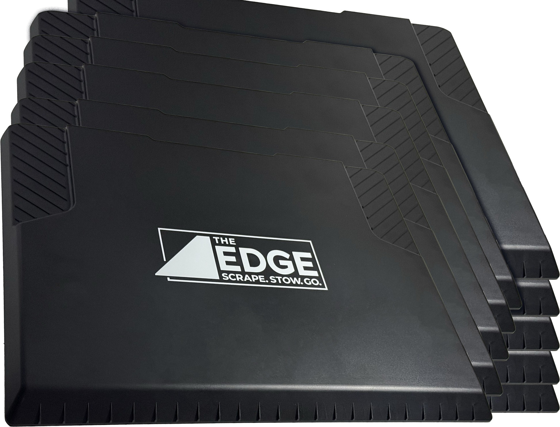 Stack of black car mats with 'The Edge' logo on a white background