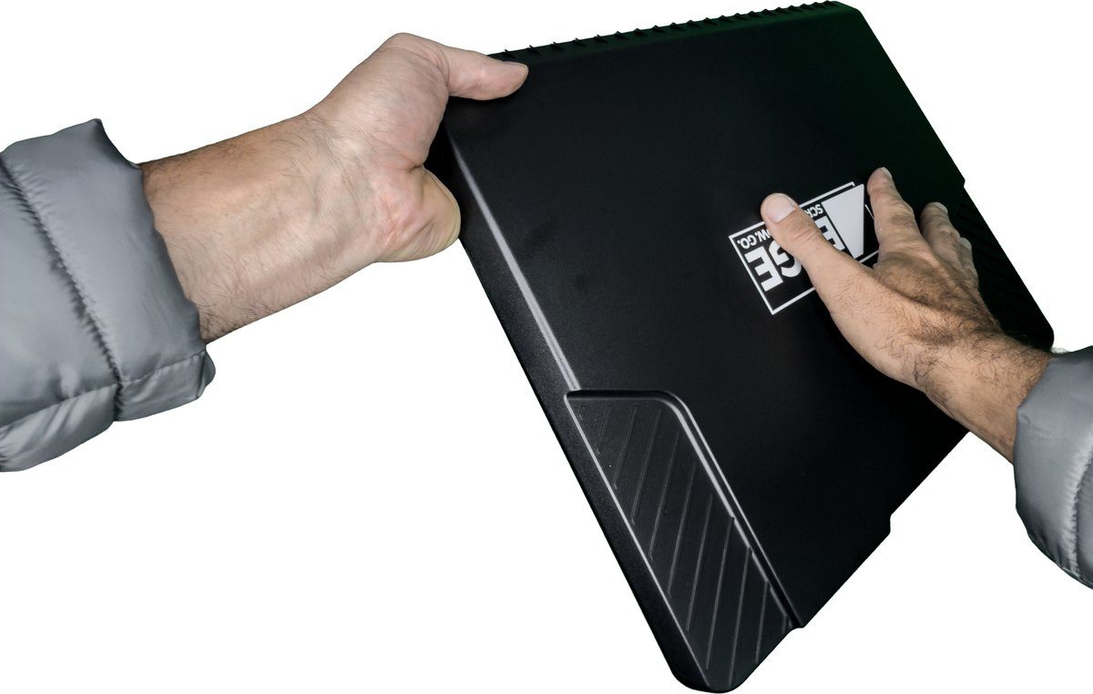 Snow Clearing Hold: one hand flat on the logo side, the other gripping a 14 inch side edge near its far end