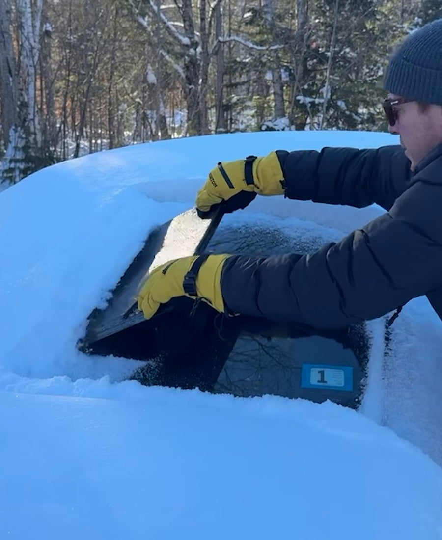 Leaning on The EDGE to scrape windshield ice