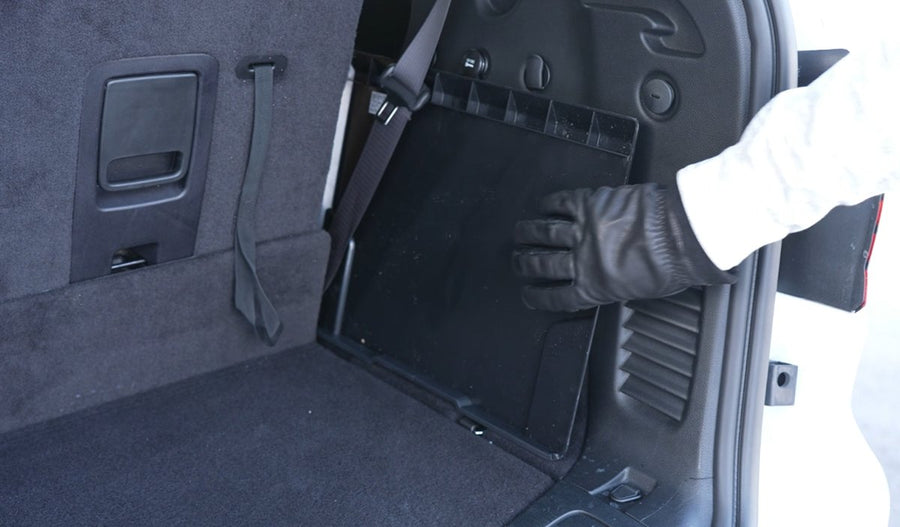 The EDGE stowed upright at the side of a trunk